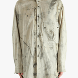 Grey shirt worn by a person, showing the shirt's fit