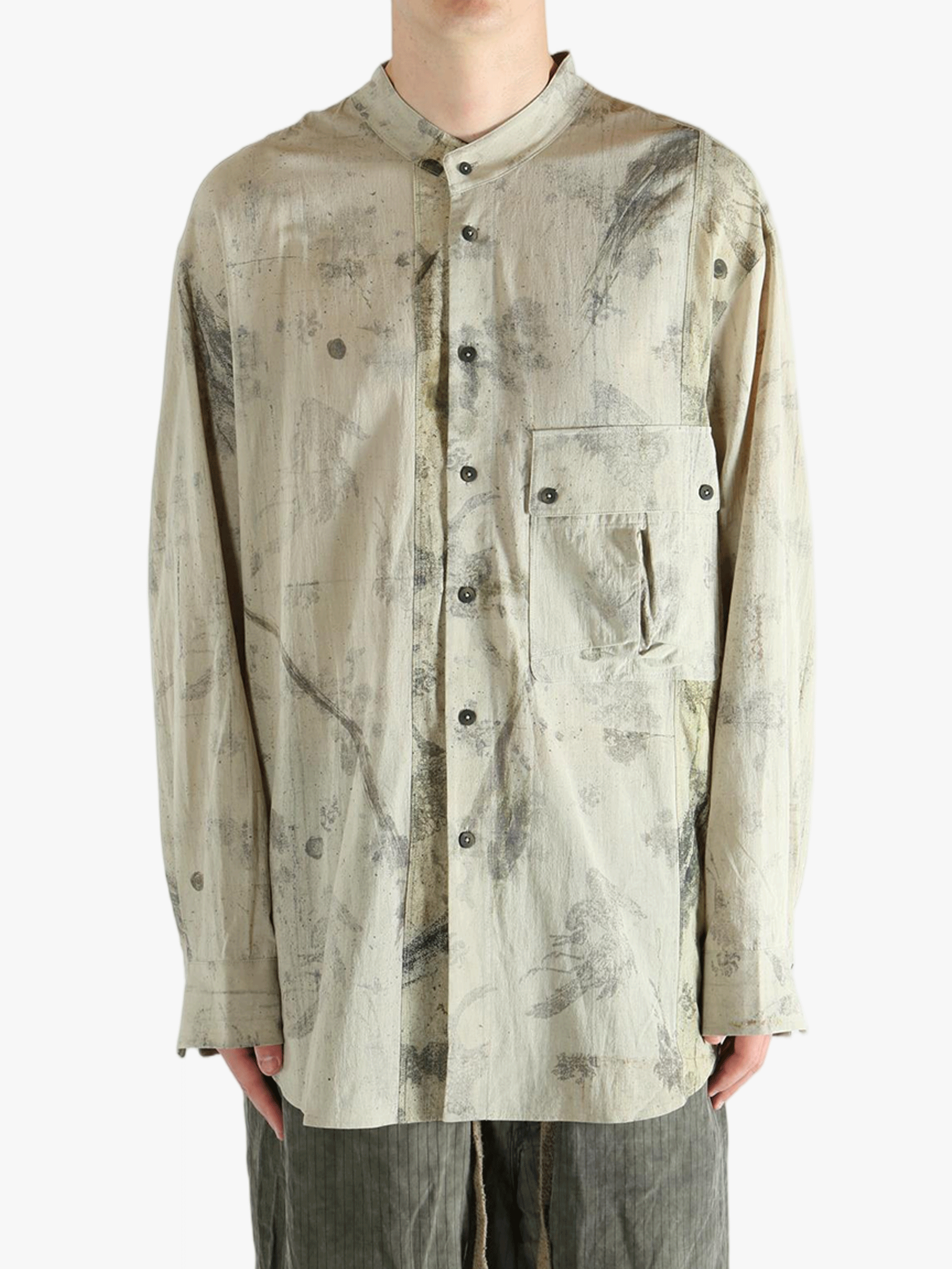 Grey shirt worn by a person, showing the shirt's fit