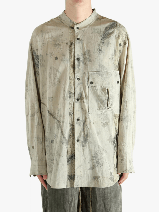 Grey shirt worn by a person, showing the shirt's fit