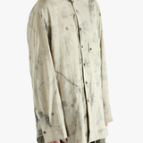 Grey shirt worn by a person, showing the shirt's fit