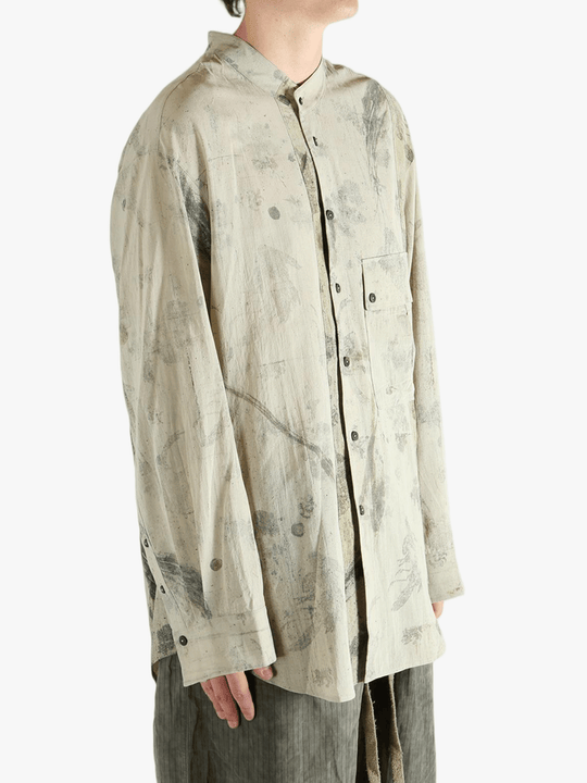 Grey shirt worn by a person, showing the shirt's fit