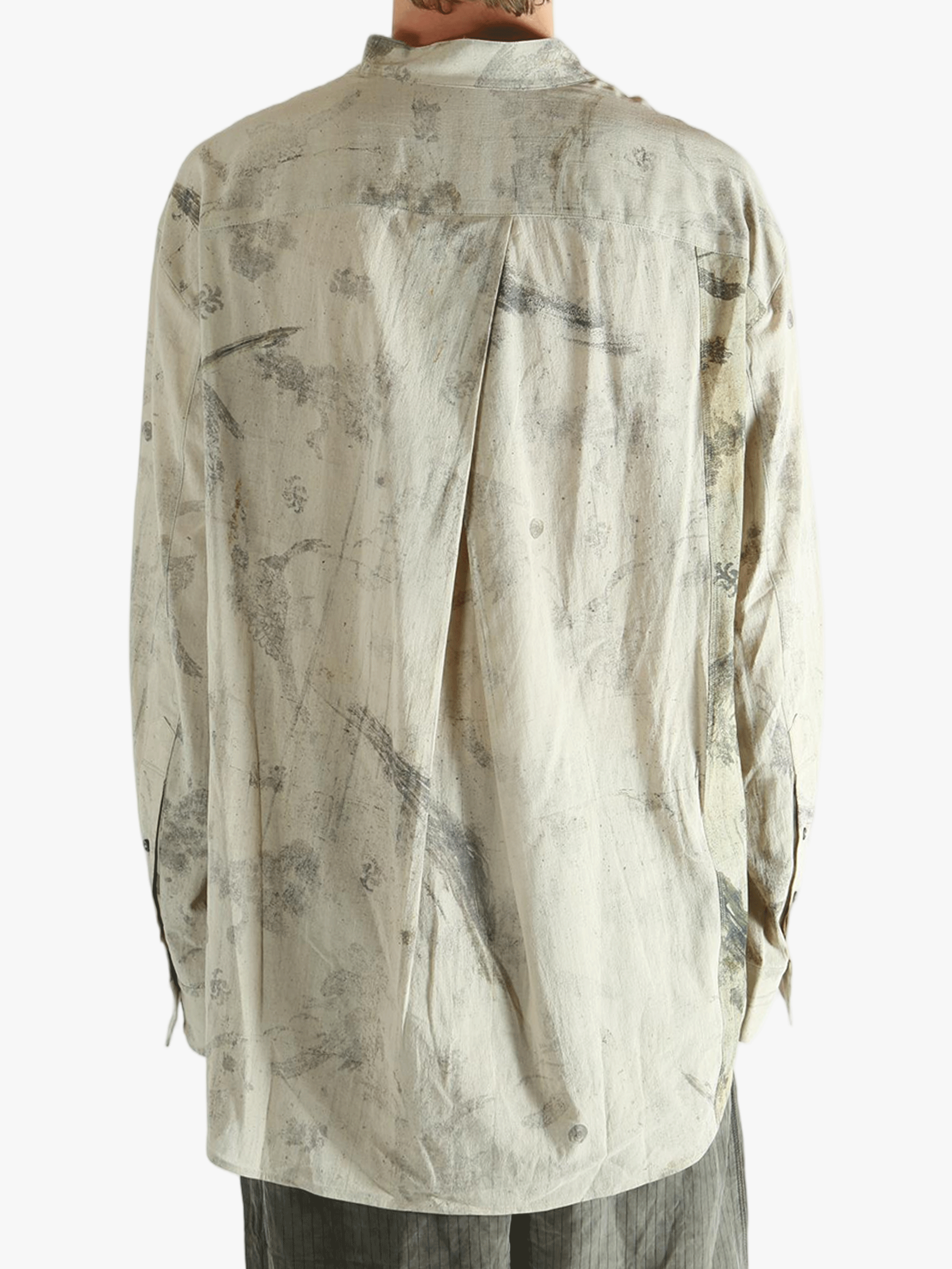 Grey shirt worn by a person, showing the shirt's fit
