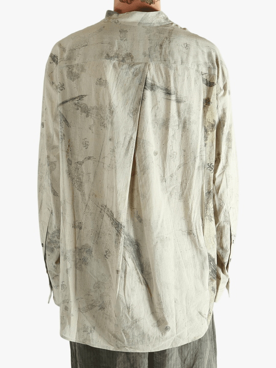 Grey shirt worn by a person, showing the shirt's fit