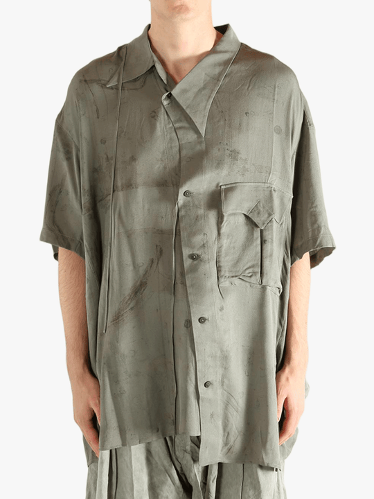 Green shirt worn by a person, showing the shirt's fit