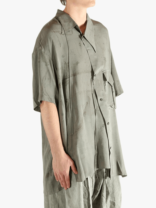 Green shirt worn by a person, showing the shirt's fit