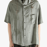 Grey shirt worn by a person, showing the shirt's fit