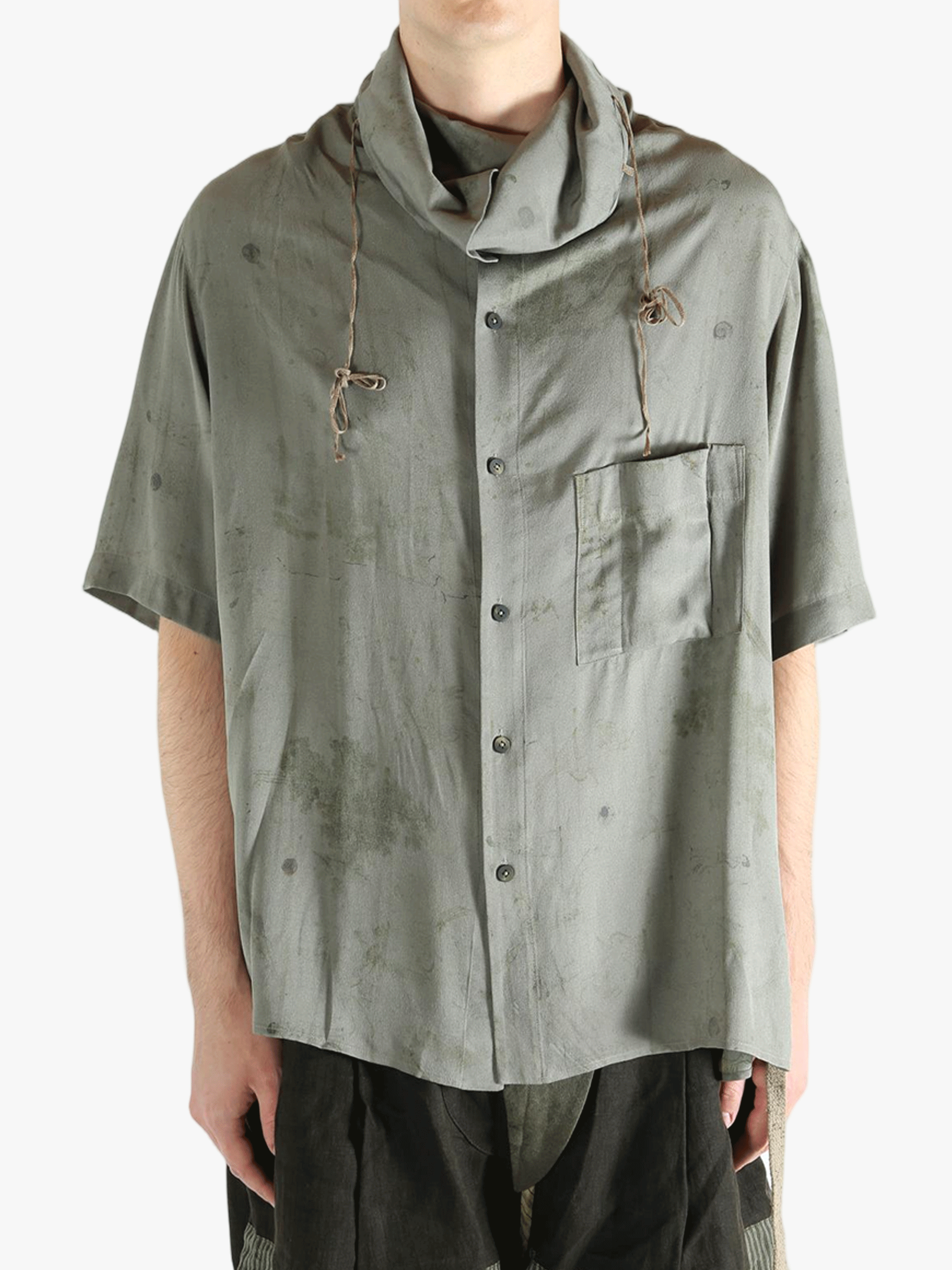 Grey shirt worn by a person, showing the shirt's fit