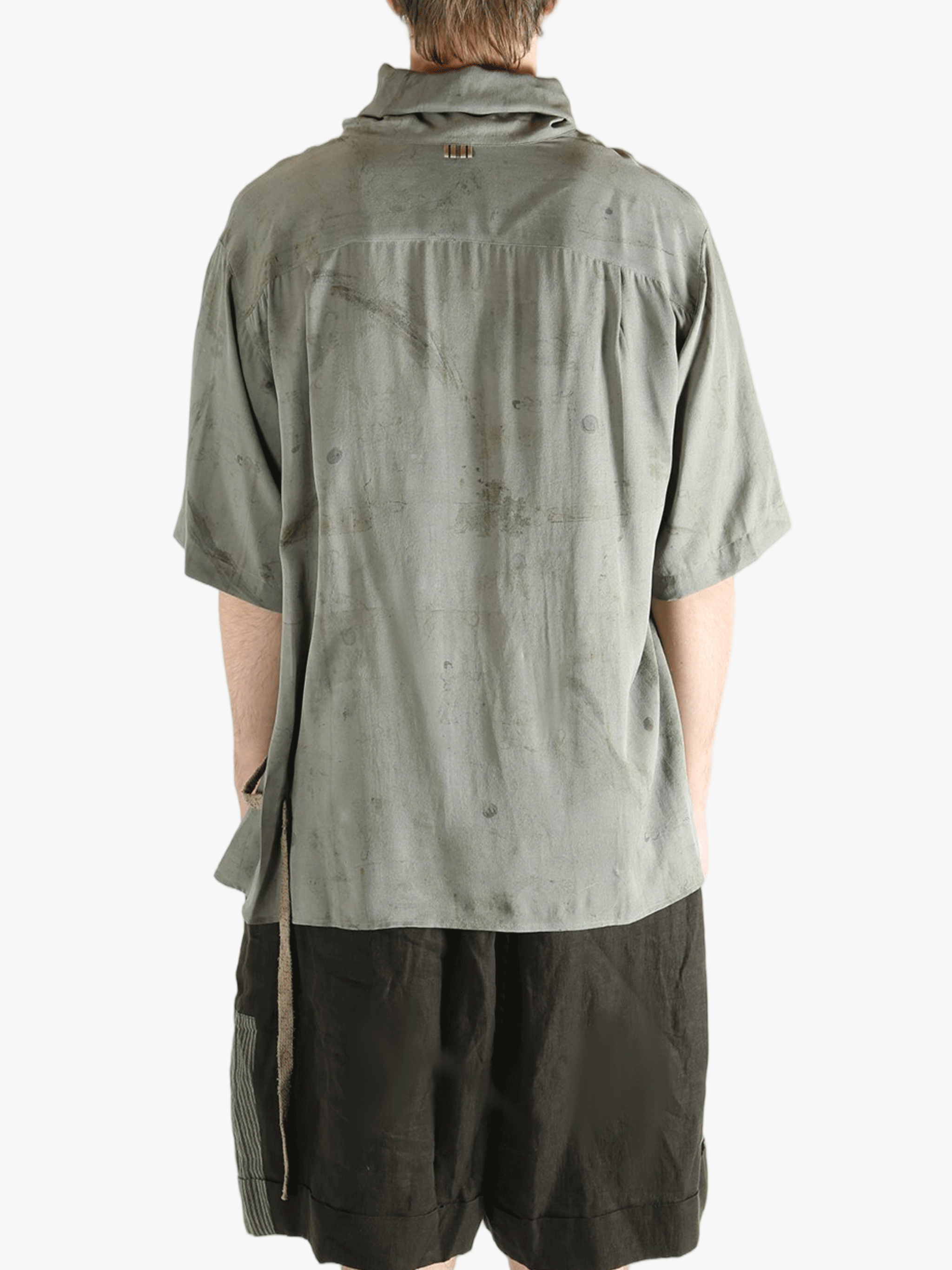 Grey shirt worn by a person, showing the shirt's fit