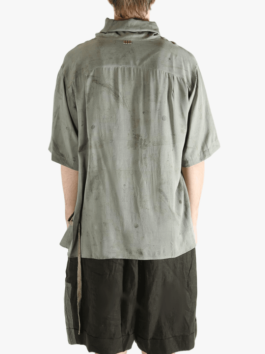 Grey shirt worn by a person, showing the shirt's fit
