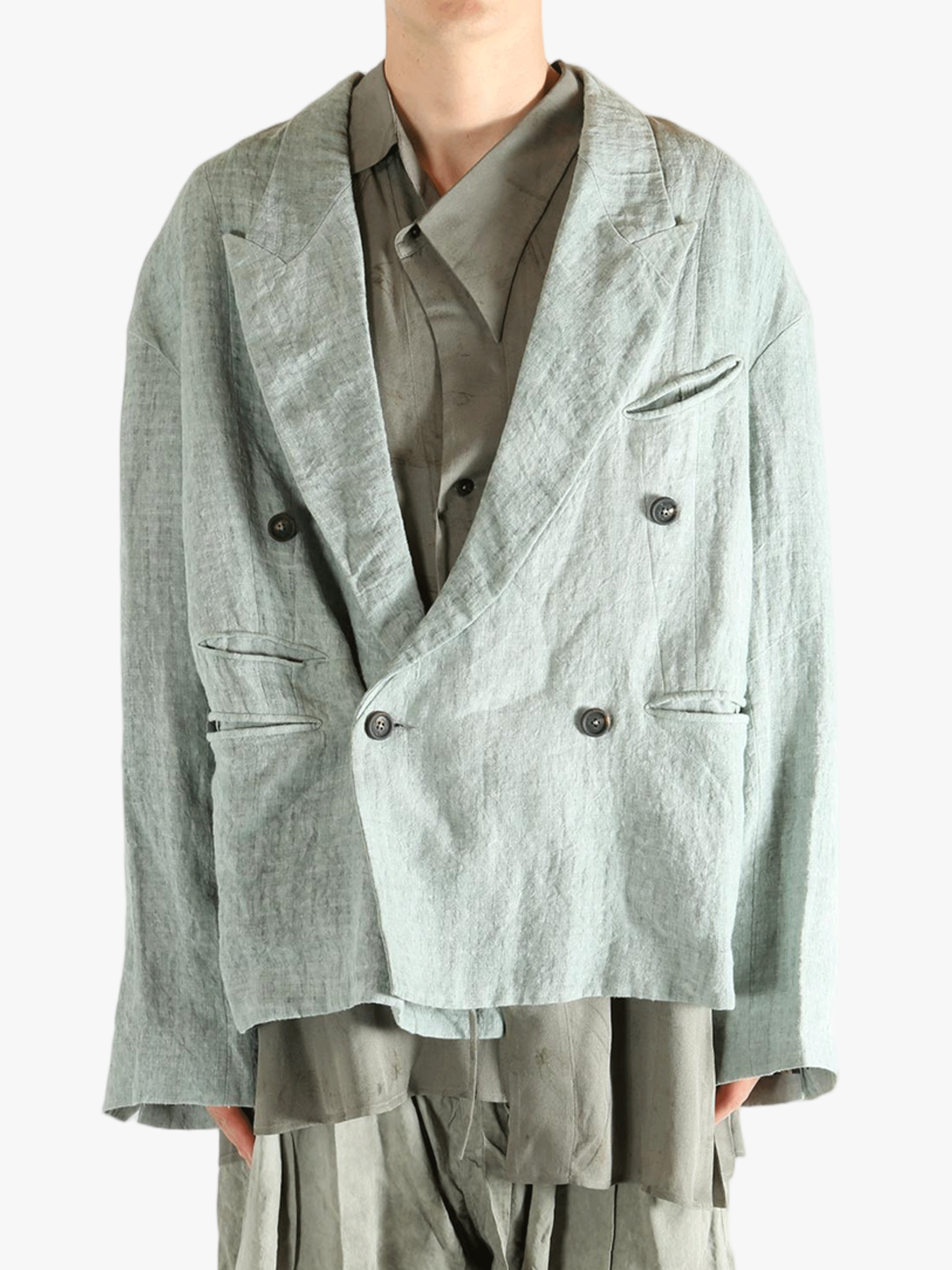 Grey jackets worn by a person, showing the jackets fit