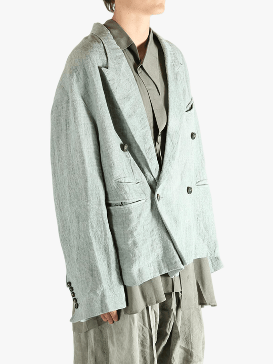 Grey jackets worn by a person, showing the jackets fit