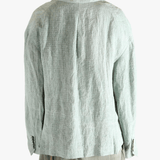 Grey jackets worn by a person, showing the jackets fit