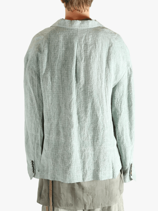 Grey jackets worn by a person, showing the jackets fit