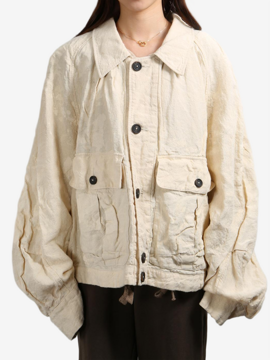 Tan jacket worn by a person, showing the tan jacket's fit
