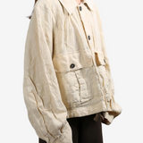 Tan jacket worn by a person, showing the tan jacket's fit