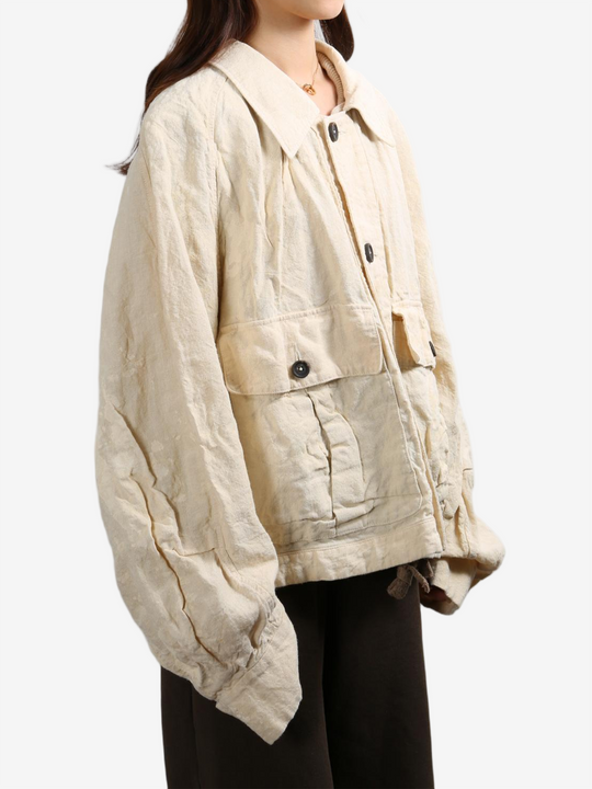 Tan jacket worn by a person, showing the tan jacket's fit