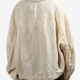 Tan jacket worn by a person, showing the tan jacket's fit