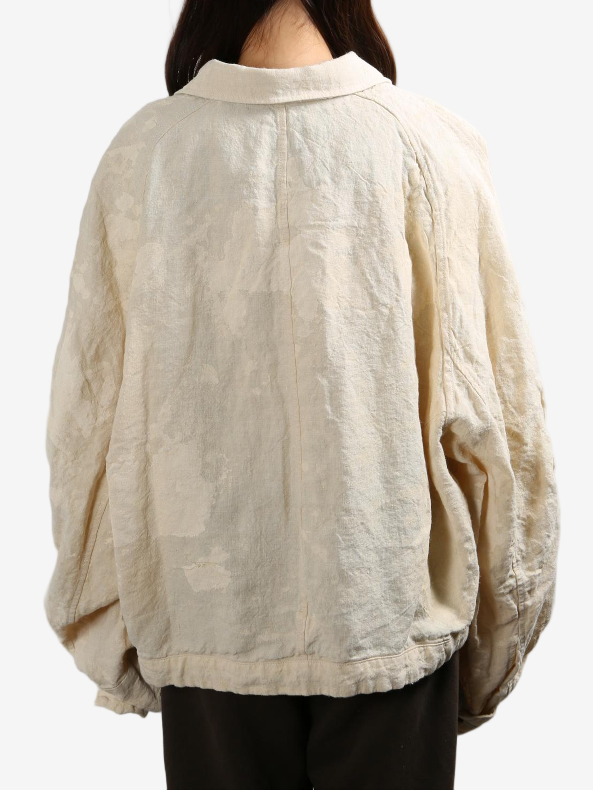 Tan jacket worn by a person, showing the tan jacket's fit