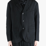 black jackets-coats worn by a person, showing the jackets-coats fit