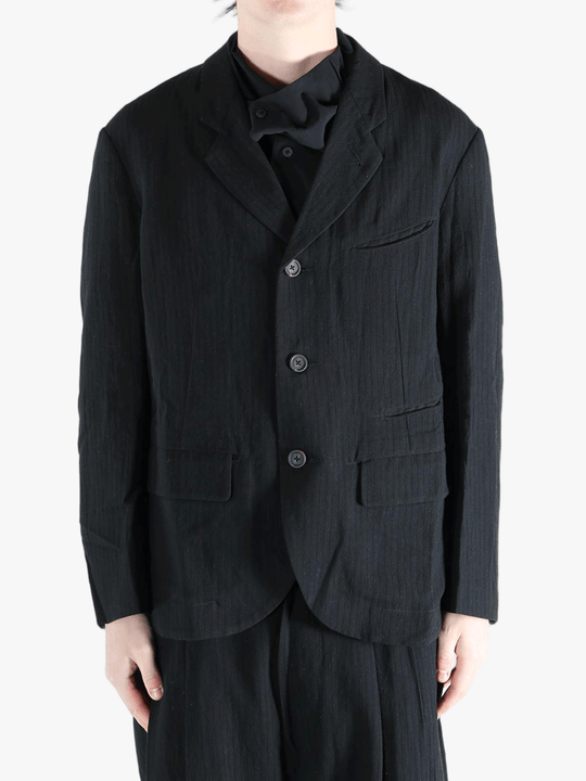 black jackets-coats worn by a person, showing the jackets-coats fit