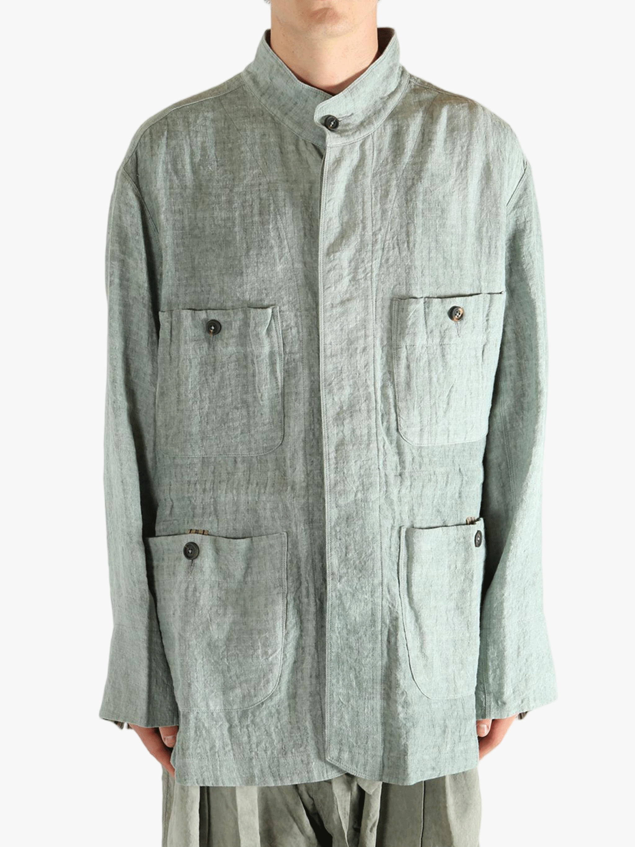 Green shirt worn by a person, showing the shirt's fit