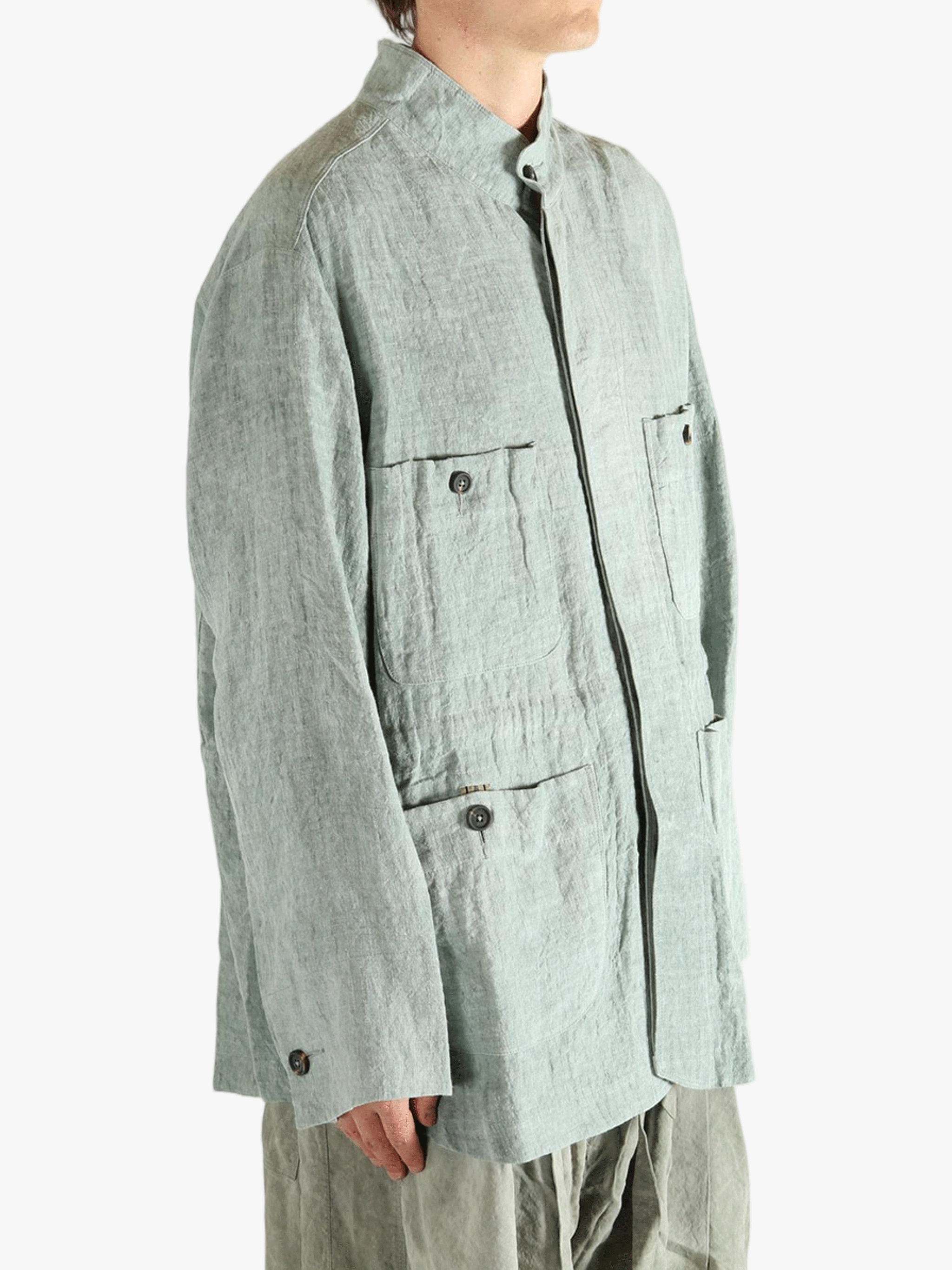 Green shirt worn by a person, showing the shirt's fit