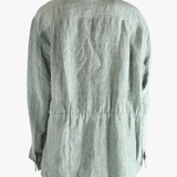 Green shirt worn by a person, showing the shirt's fit