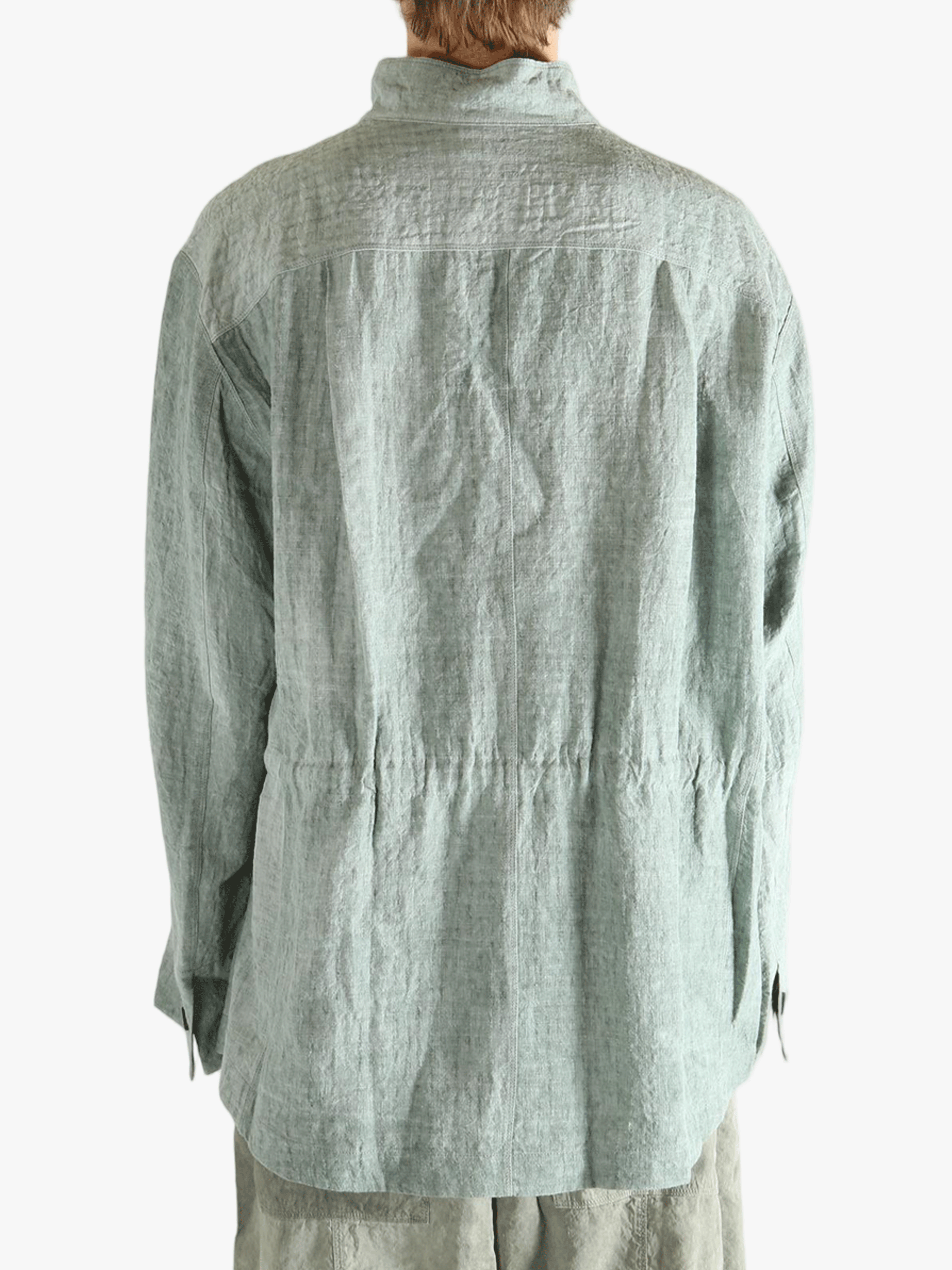 Green shirt worn by a person, showing the shirt's fit