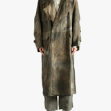 Green coat worn by a person, showing the coat's fit