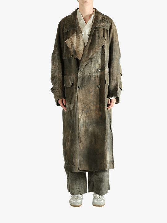 Green coat worn by a person, showing the coat's fit
