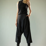 Black pants worn by a person, showing the pants' fit