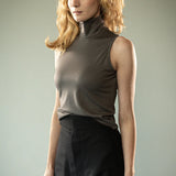 Grey top worn by a person, showing the top's fit