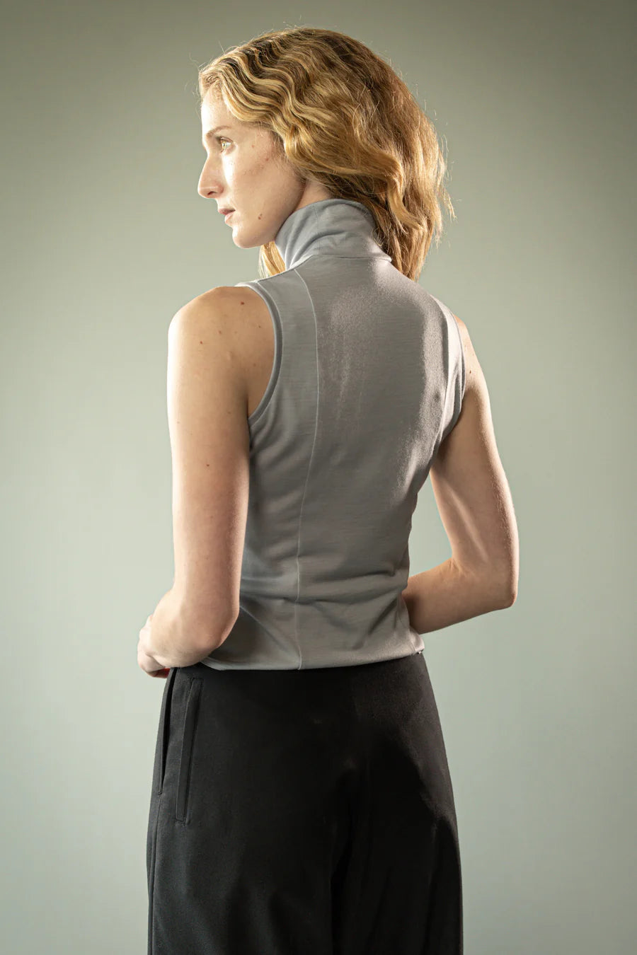 Grey top worn by a person, showing the top's fit