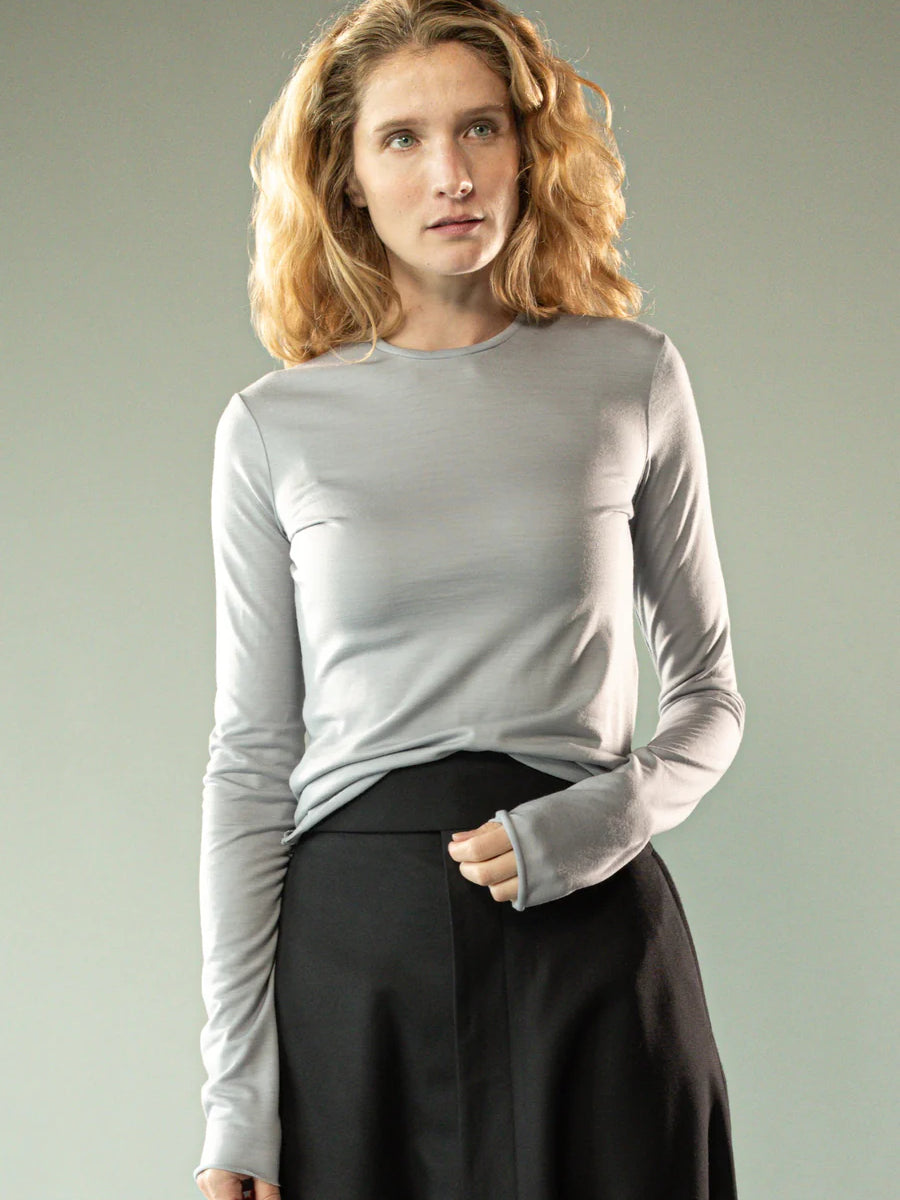 Grey knitwear worn by a person, showing the knitwear's fit