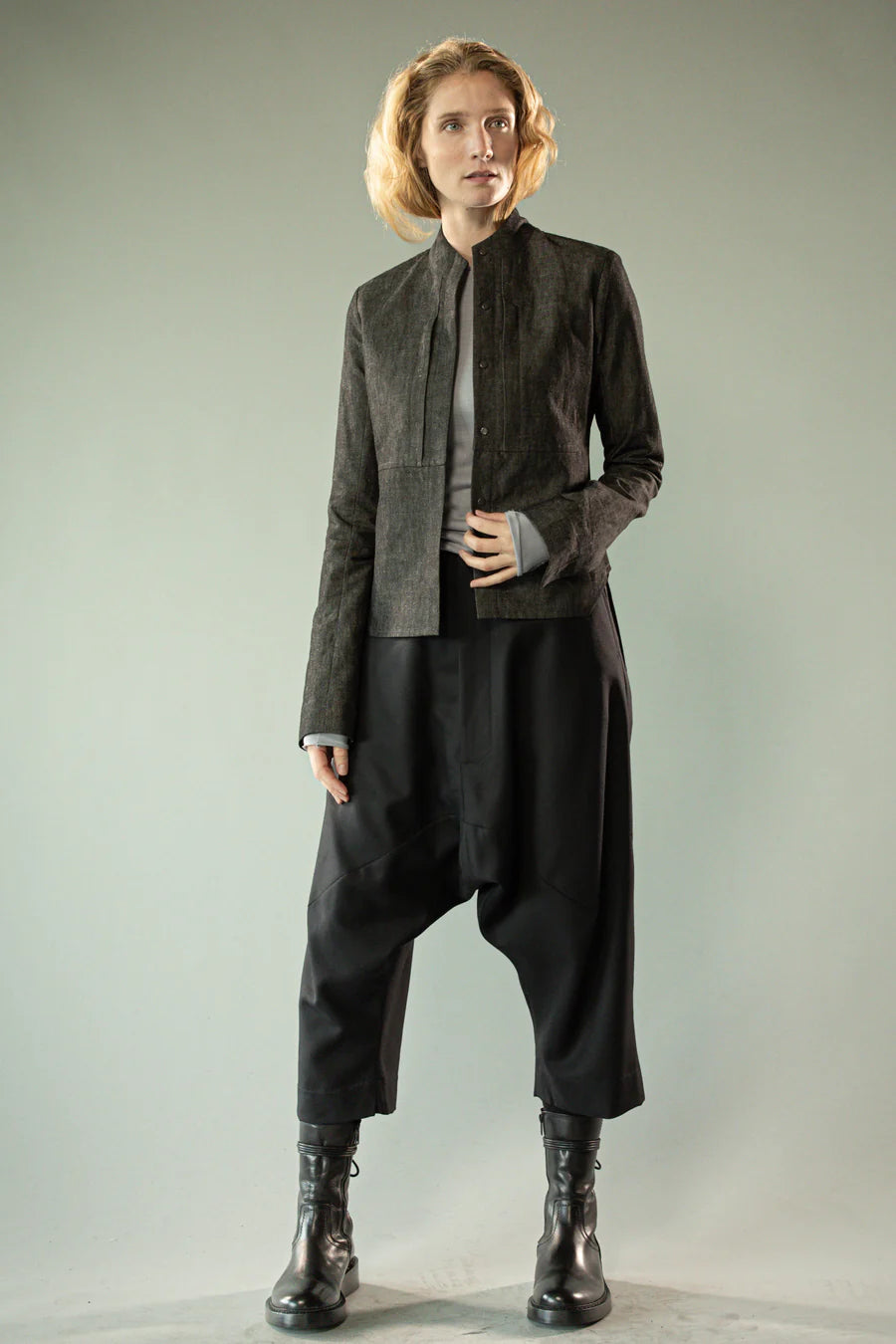 Black pants worn by a person, showing the pants' fit