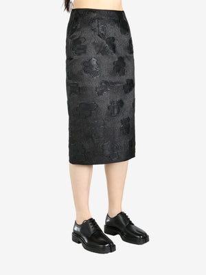 Black skirt worn by a person, showing the skirt's fit