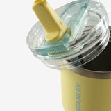 Close up of yellow tumbler, showing texture of the stainless steel fabric