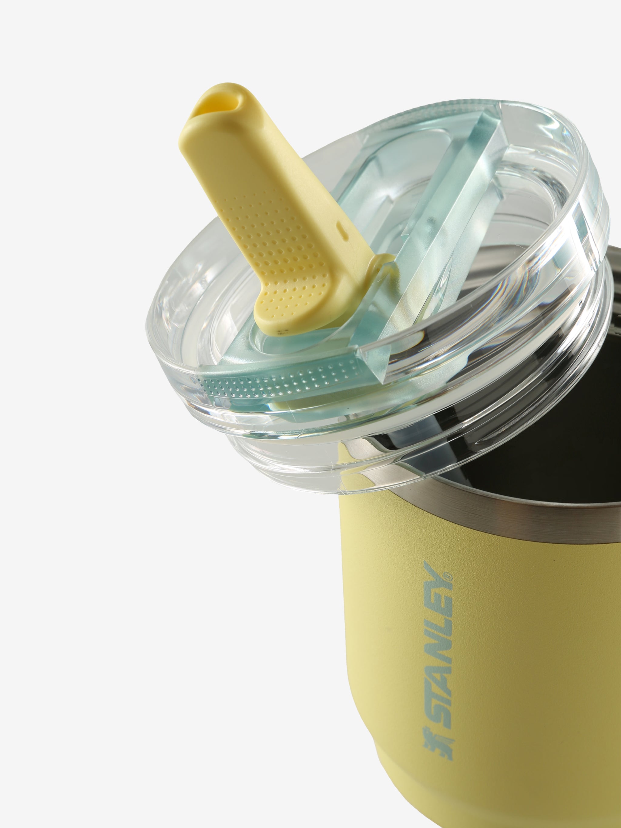 Close up of yellow tumbler, showing texture of the stainless steel fabric