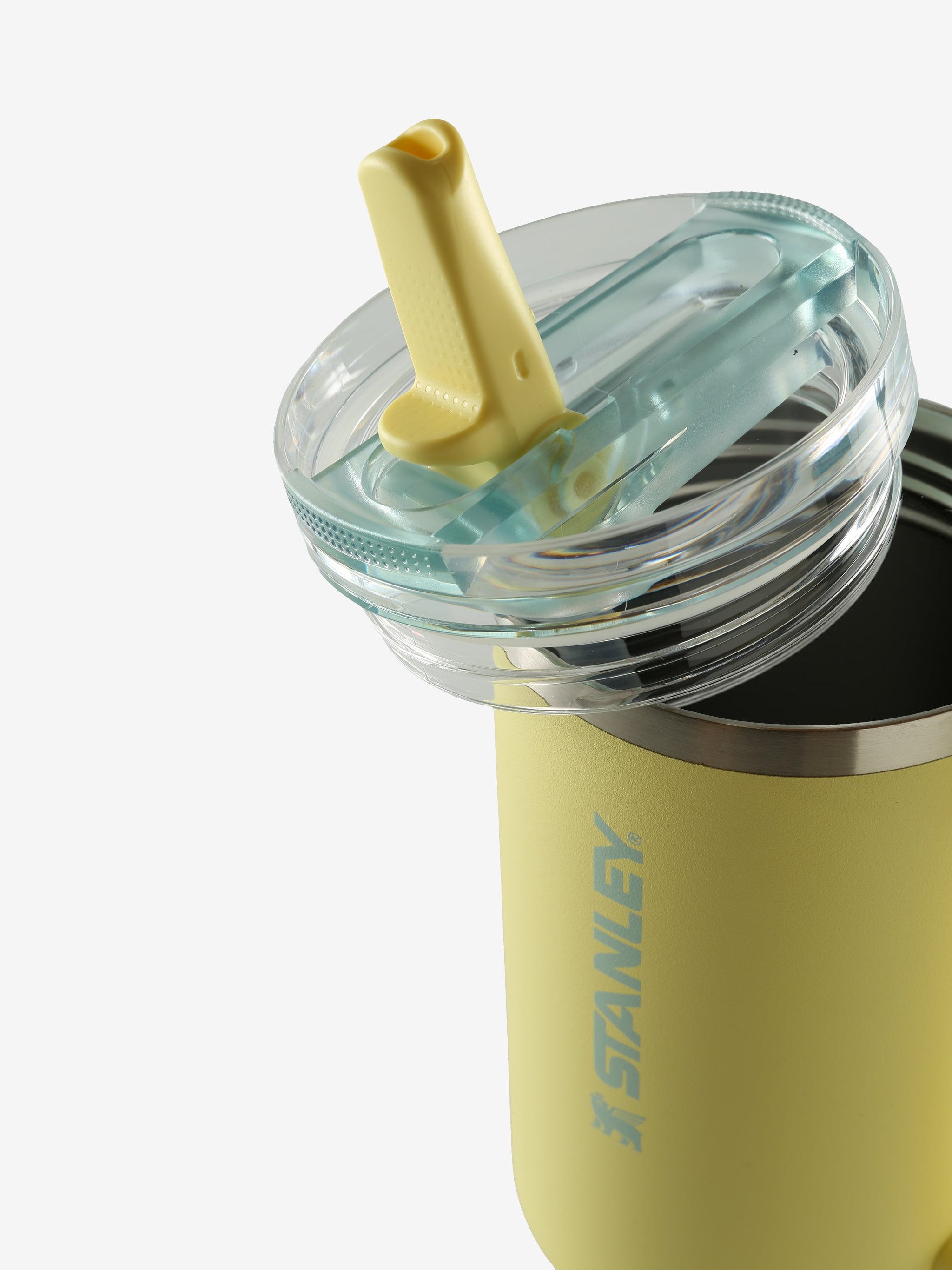 Close up of yellow tumbler, showing texture of the stainless steel fabric