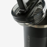 Close up of black tumbler, showing texture of the stainless steel fabric
