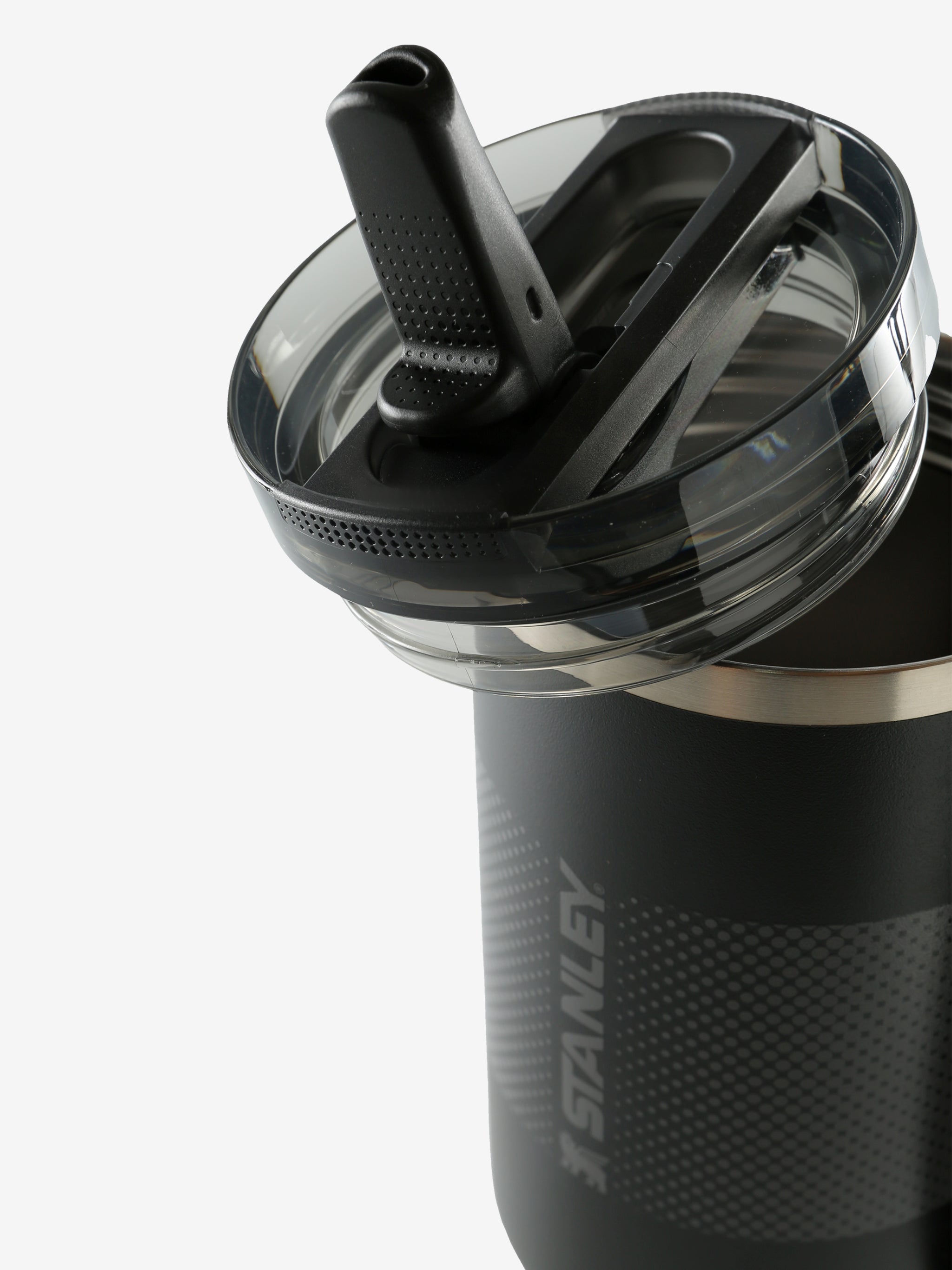 Close up of black tumbler, showing texture of the stainless steel fabric