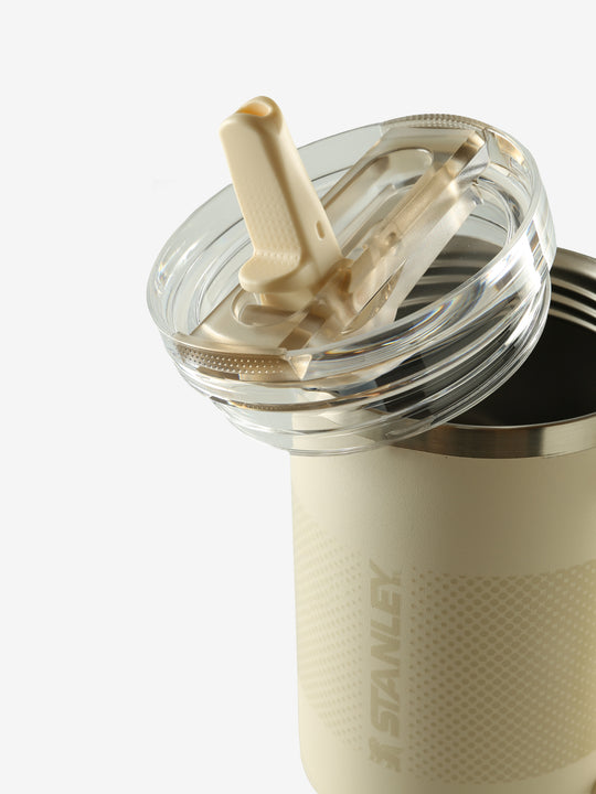 Close up of tan tumbler, showing texture of the stainless steel fabric