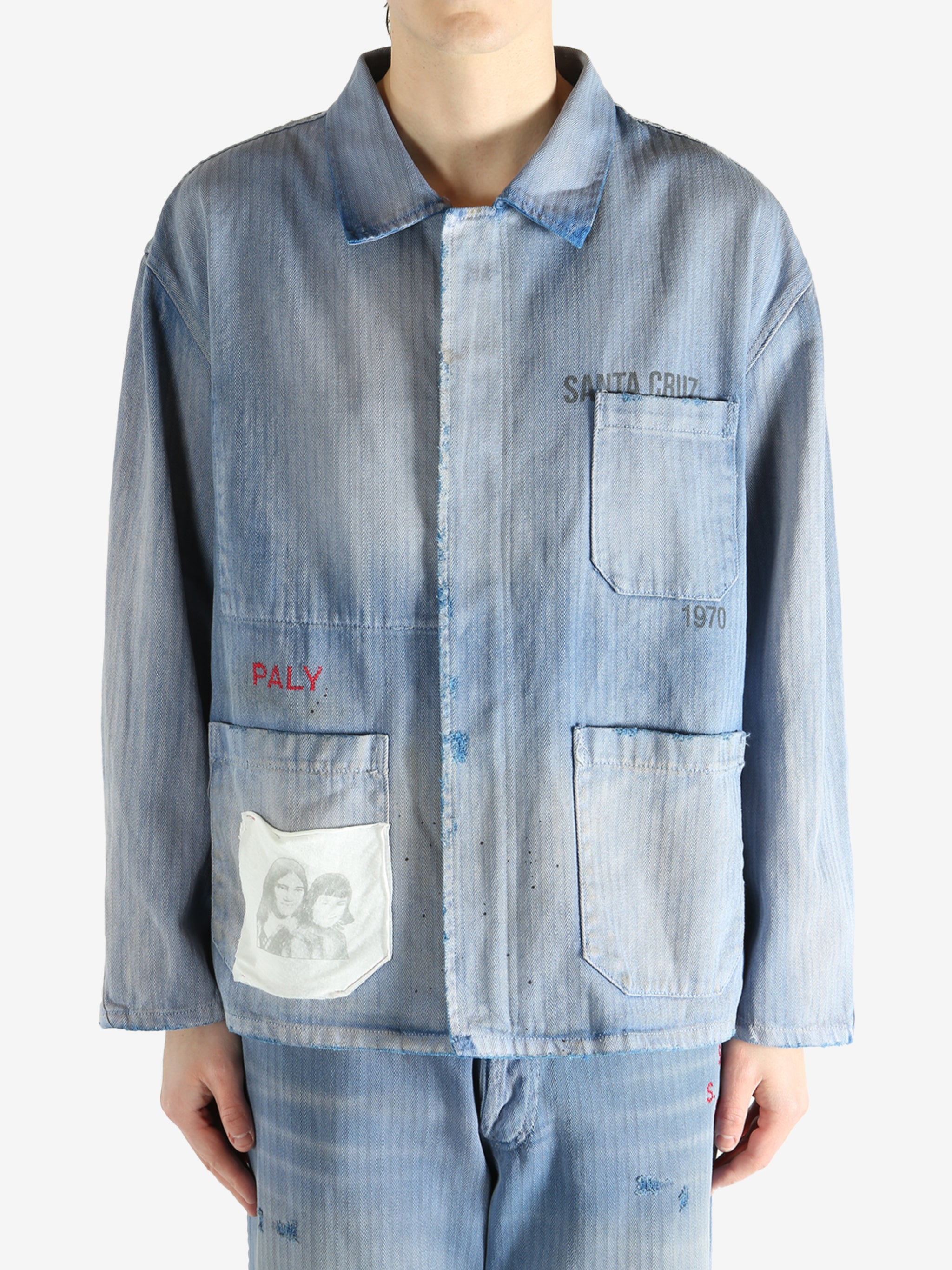 Blue jacket worn by a person, showing the jacket fit