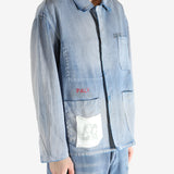 Blue jacket worn by a person, showing the jacket fit