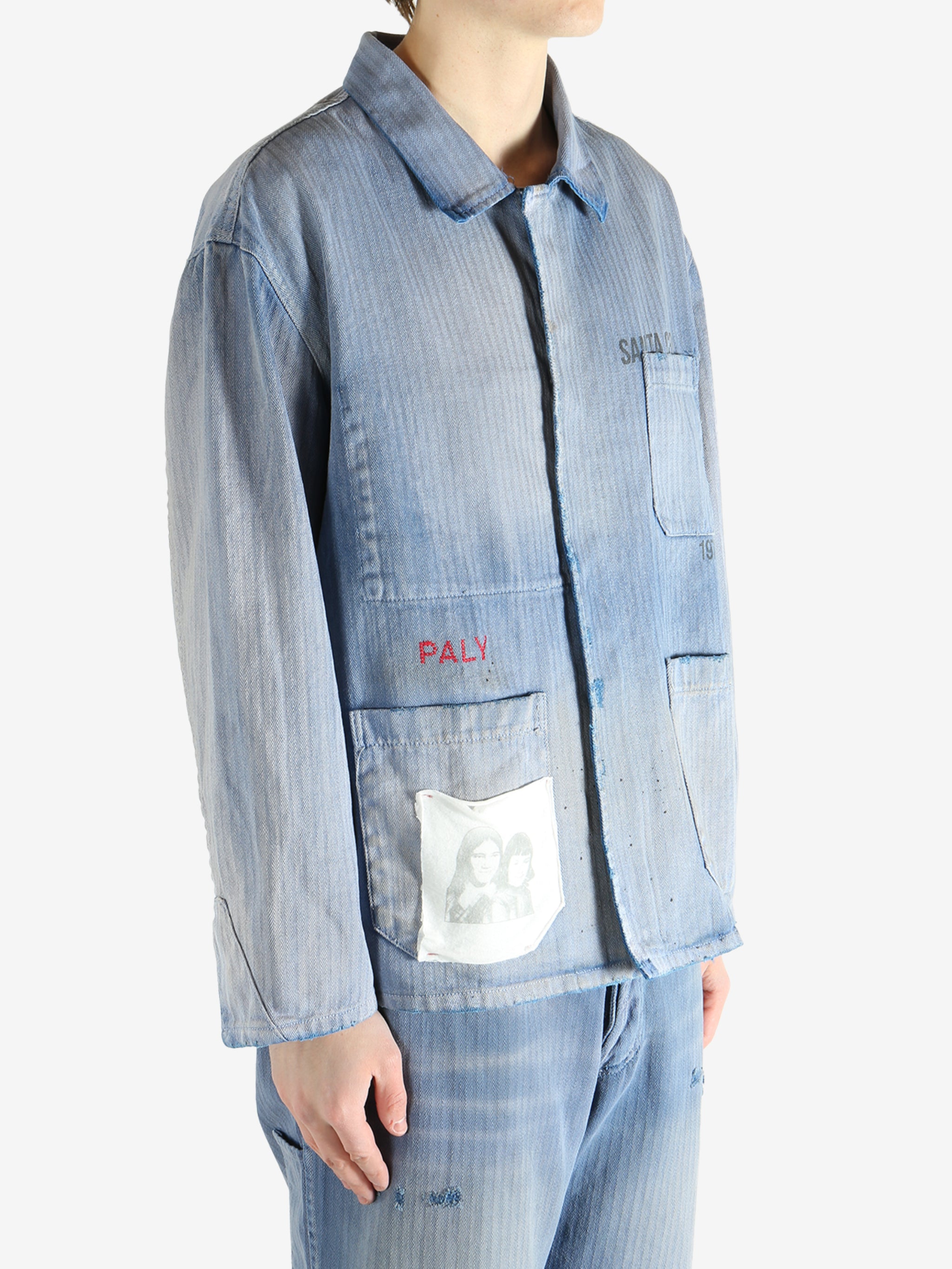 Blue jacket worn by a person, showing the jacket fit