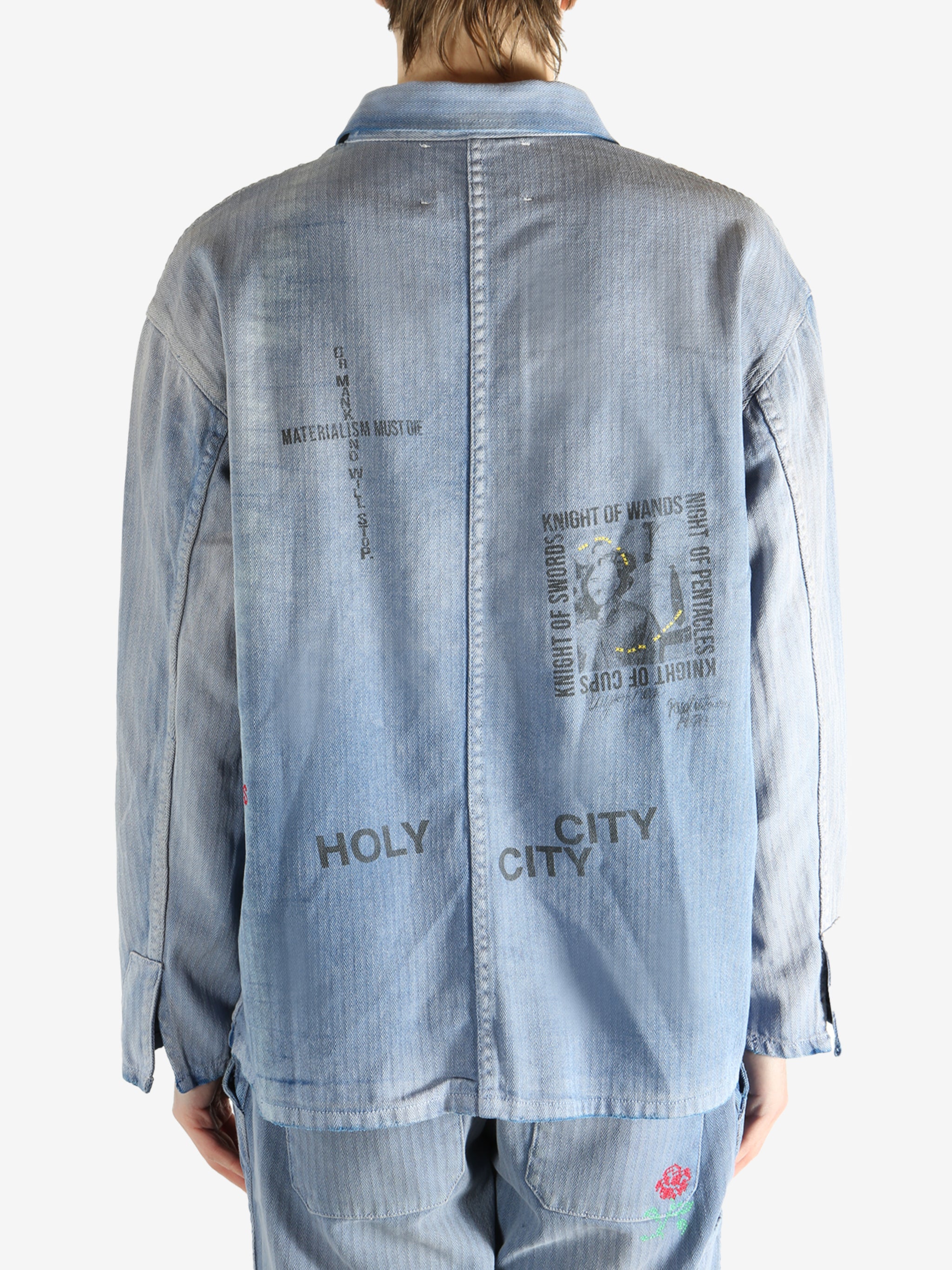 Blue jacket worn by a person, showing the jacket fit