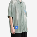 Green shirt, full body view