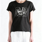 Black t-shirt worn by a person, showing the t-shirt fit