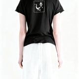 Black t-shirt worn by a person, showing the t-shirt fit