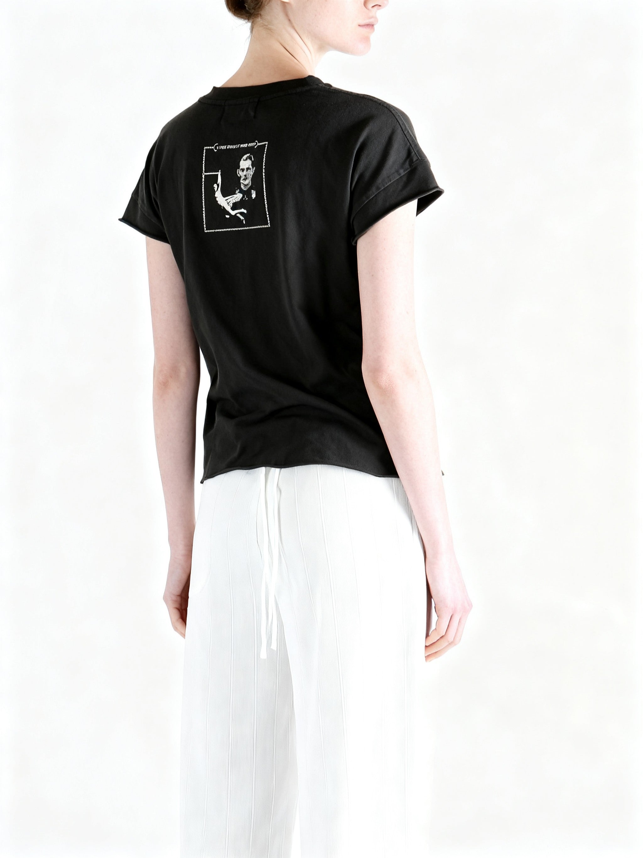 Black t-shirt worn by a person, showing the t-shirt fit